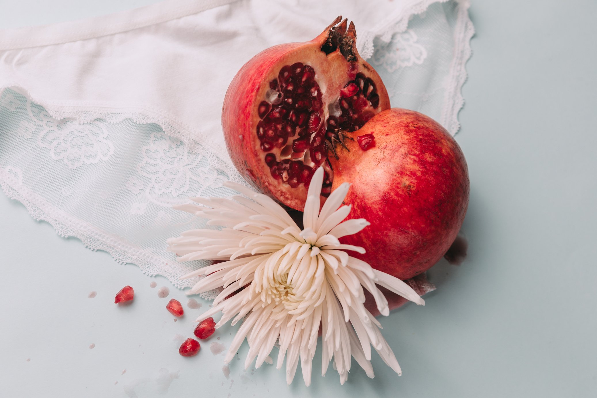 Sliced Pomegranate with White Flower